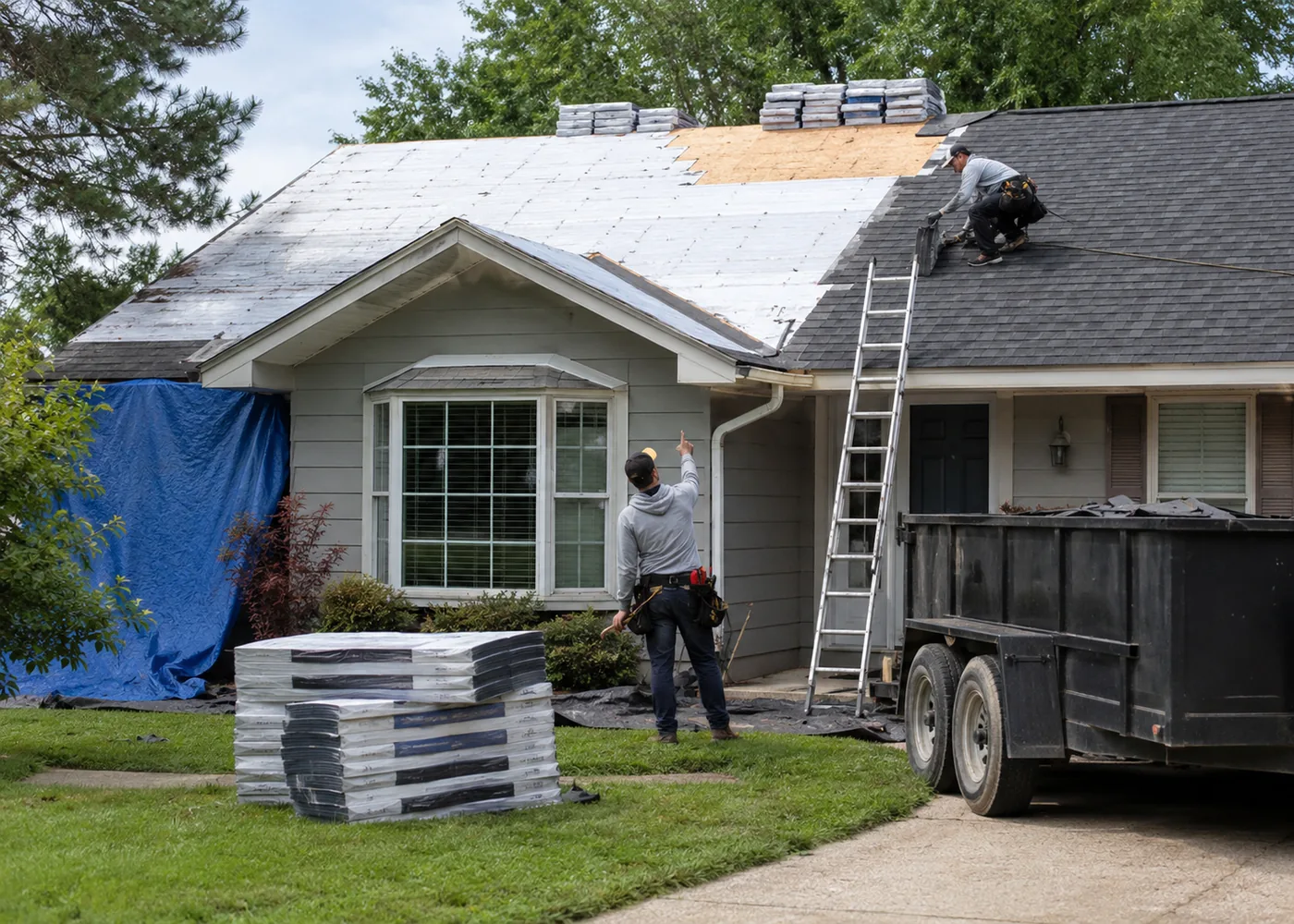 Roof Replacement in Pleasant Prairie - WI in progress as installers secure new shingles on a two-story home